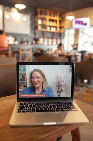 macbook-mockup-standing-on-the-corner-of-a-wooden-table-a20998
